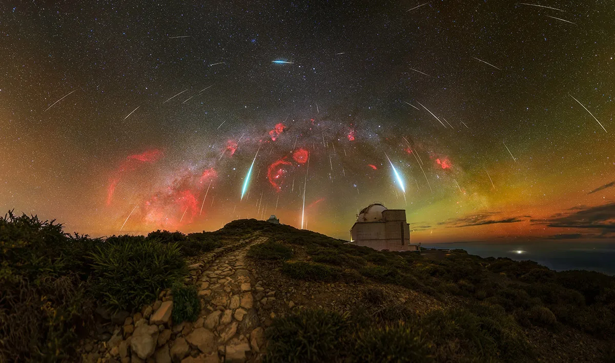 A Cosmic Firework: the Geminid Meteor Shower © Jakob Sahner (Germany) Taken with a Sony ILCE-7M3 camera, Sigma 28 mm f/1.4 lens, Sky-Watcher Star Adventurer mount, 28 mm f/1.4, Sky: 14 panels of 60-second RGB exposures (ISO 1,600), 5 panels of 3 x 180-second H-alpha exposures (ISO 6,400); Foreground: 16 panels of 60-second exposures (ISO 1,600) Location: Roque de los Muchachos, La Palma, Canary Islands, Spain, 11 and 15 December 2023