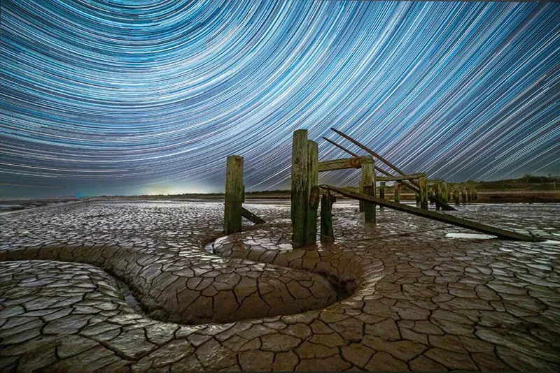 Serpentine © Paul Haworth (UK) Taken with a Canon 6D camera, Samyang 14 mm f/2.8 lens, ISO 400, 319 x 30-second exposures Foreground: ISO 800, 120-second exposure Location: Snettisham Beach, King’s Lynn, Norfolk, UK, 19 and 20 April 2023